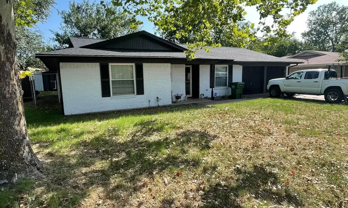 Professional roofing crew working on a residential roof in Oxford